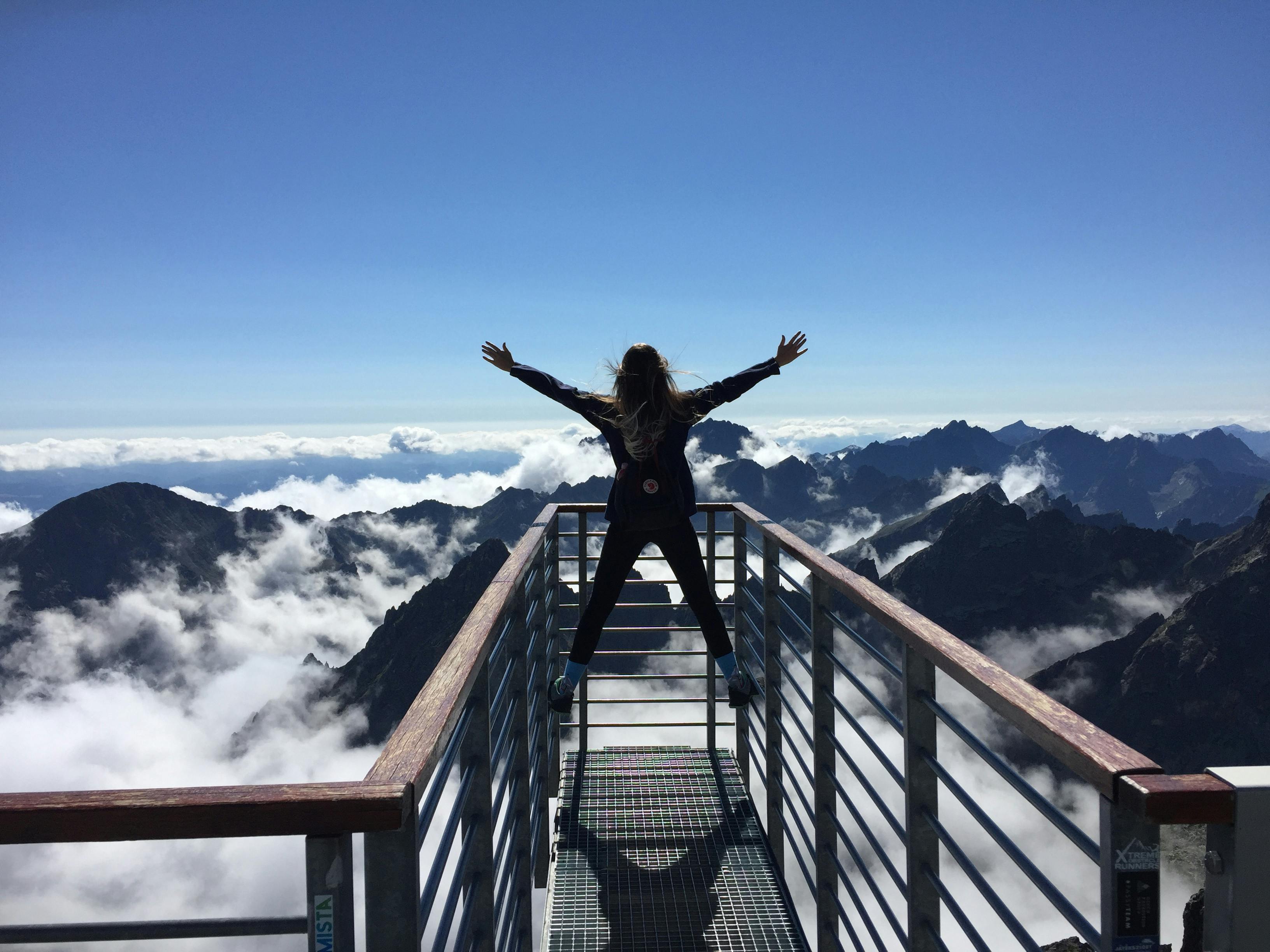 Image of girl spreading arms in joy
